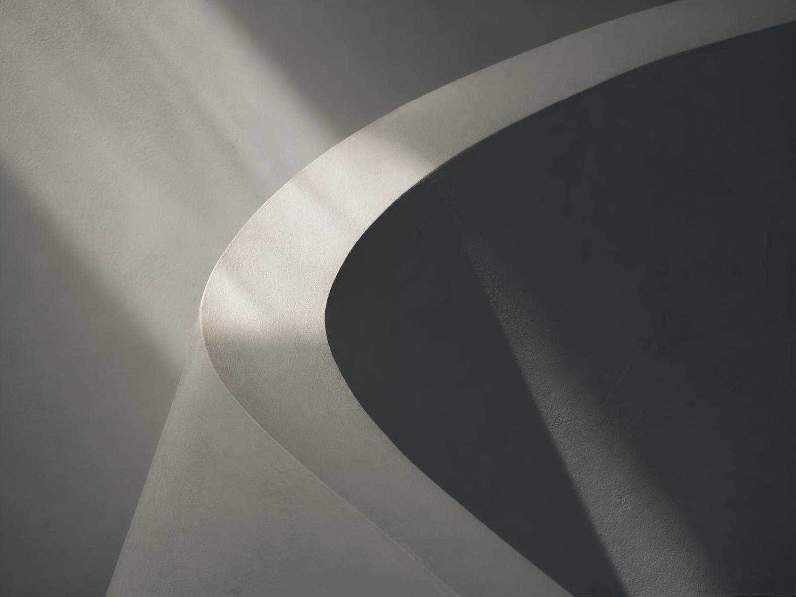 Soft daylight across a sculptural curved form